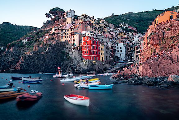 white-and-red-boat-on-water-near-brown-concrete-buildings-3711348.jpg